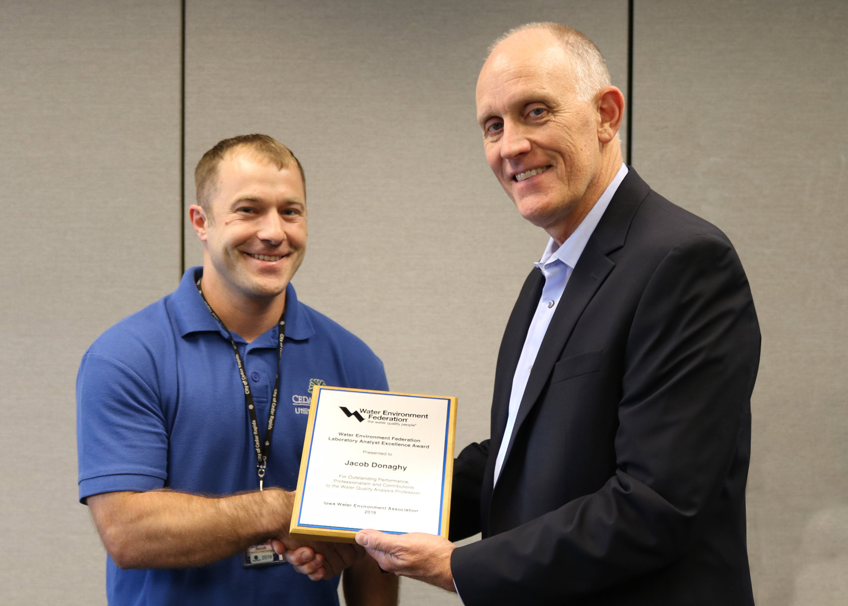 Utilities Director Steve Hershner presents the Laboratory Analyst Excellence Award to Jacob Donaghy.