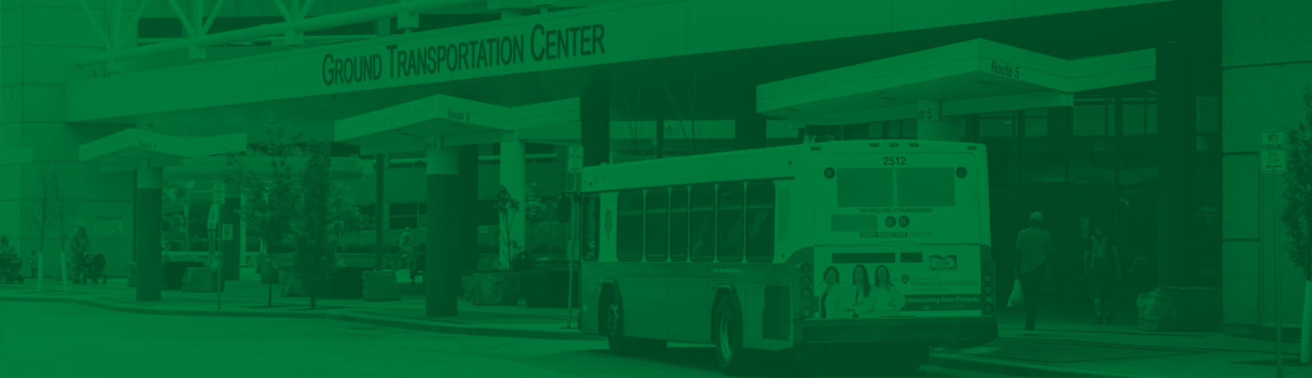 Cedar Rapids Transit bus parked outside of Ground Transportation Center in shades of green