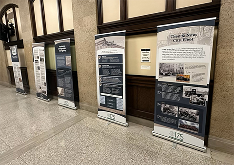A series of retractable banners featuring Cedar Rapids historical information is on display in City Hall