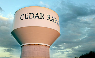 Kirkwood Boulevard Water Tank against the morning sky, the words 'Cedar Rapids' are marked upon the tank.