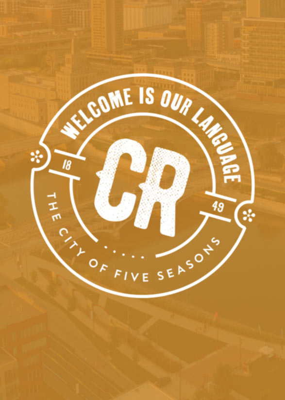 Welcome is Our Language marketing campaign stamp in front of a downtown Cedar Rapids skyline photo.